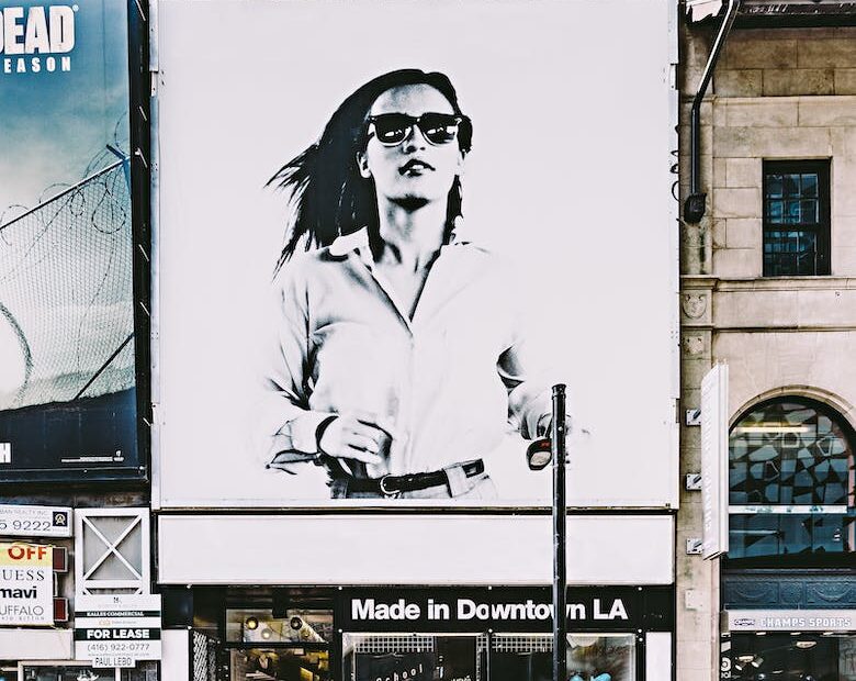 photo of billboard of woman in black and white advertising